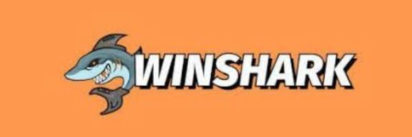 Winshark lobby showing Playson pokies on a laptop